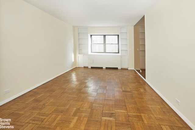 empty room with light parquet floors