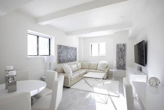 living room with beam ceiling