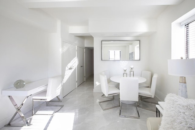 dining space featuring plenty of natural light