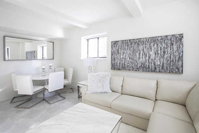 living room featuring beam ceiling