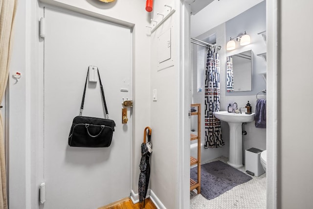 bathroom featuring sink and toilet