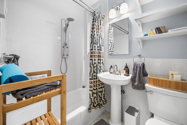 full bathroom with sink, shower / bath combo, and toilet