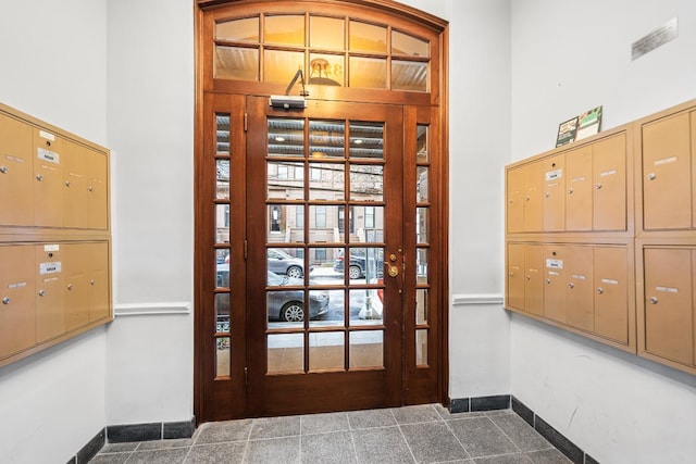 doorway featuring a mail area