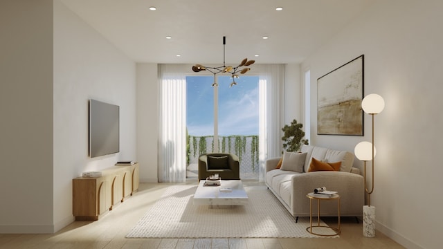 living room with a chandelier and light hardwood / wood-style flooring