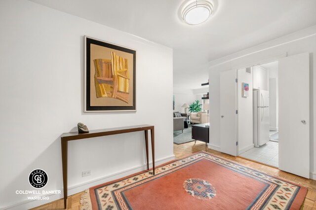 hall featuring light parquet flooring