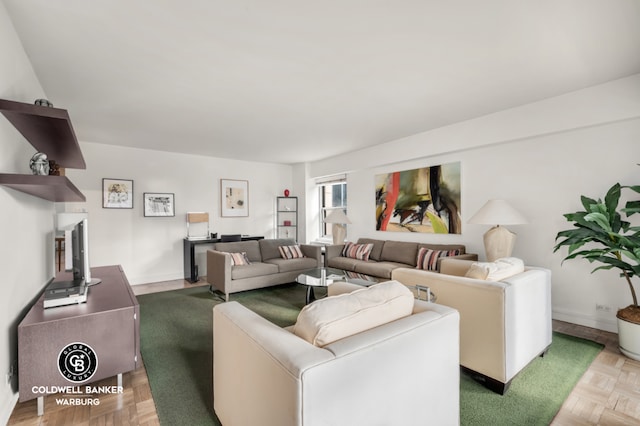 living room featuring parquet flooring