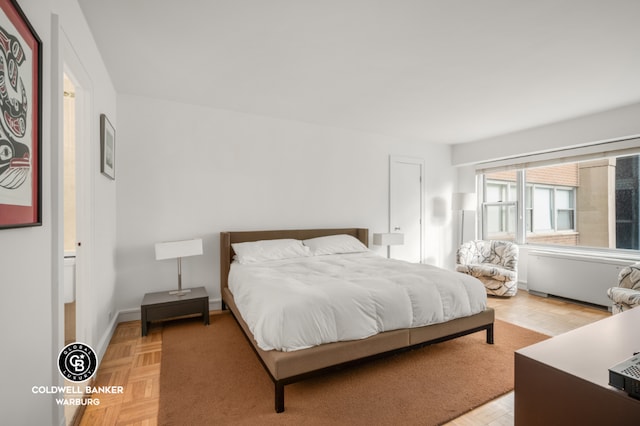 bedroom featuring light parquet flooring