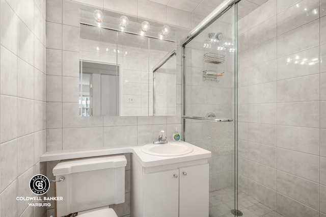 118 E 60th St Unit 28G, New York City, NY 10022 - full bath with tile walls, a shower stall, vanity, and toilet