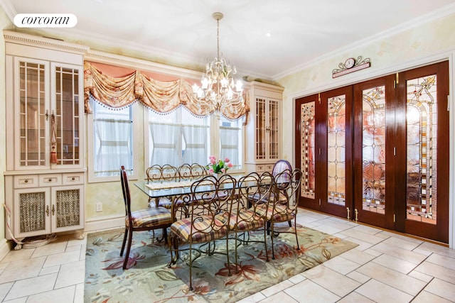 dining area with french doors, crown molding, visible vents, an inviting chandelier, and baseboards