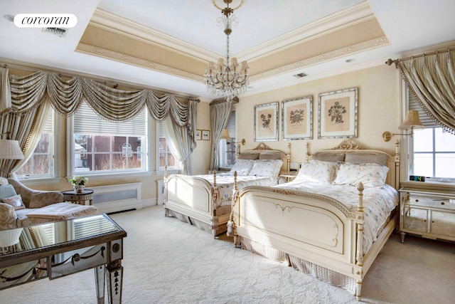 bedroom with ornamental molding, carpet floors, a tray ceiling, and visible vents