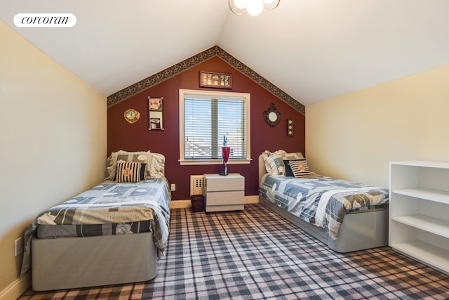 bedroom featuring lofted ceiling, baseboards, visible vents, and carpet