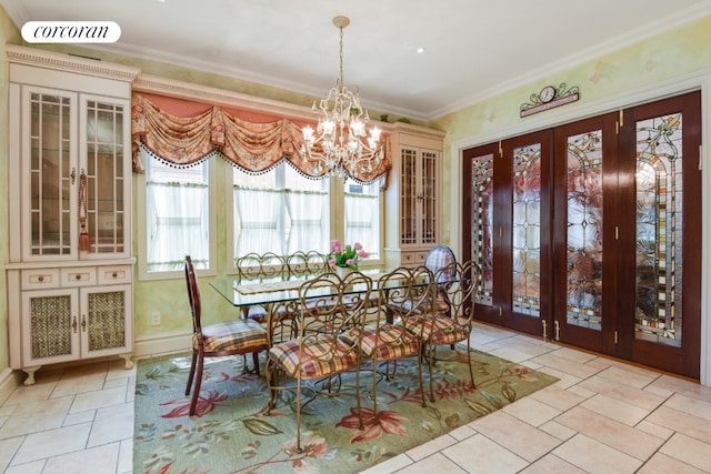 dining room with french doors, an inviting chandelier, and crown molding