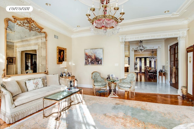 living room featuring crown molding, visible vents, an inviting chandelier, baseboards, and parquet flooring