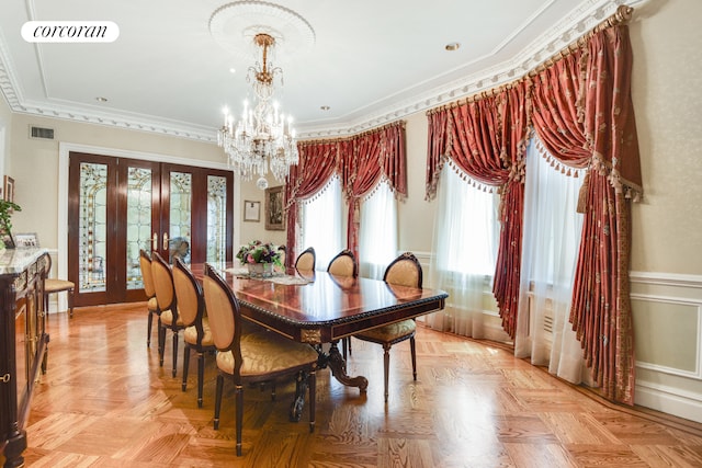 dining space with crown molding, french doors, visible vents, and a notable chandelier