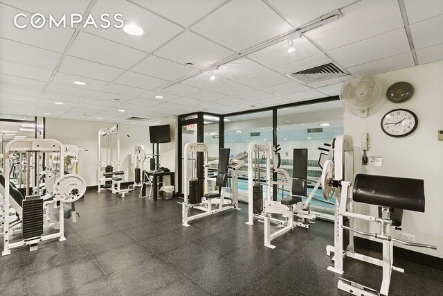 304 E 65th St Unit 38Ad, New York City, NY 10065 - gym featuring floor to ceiling windows and a paneled ceiling