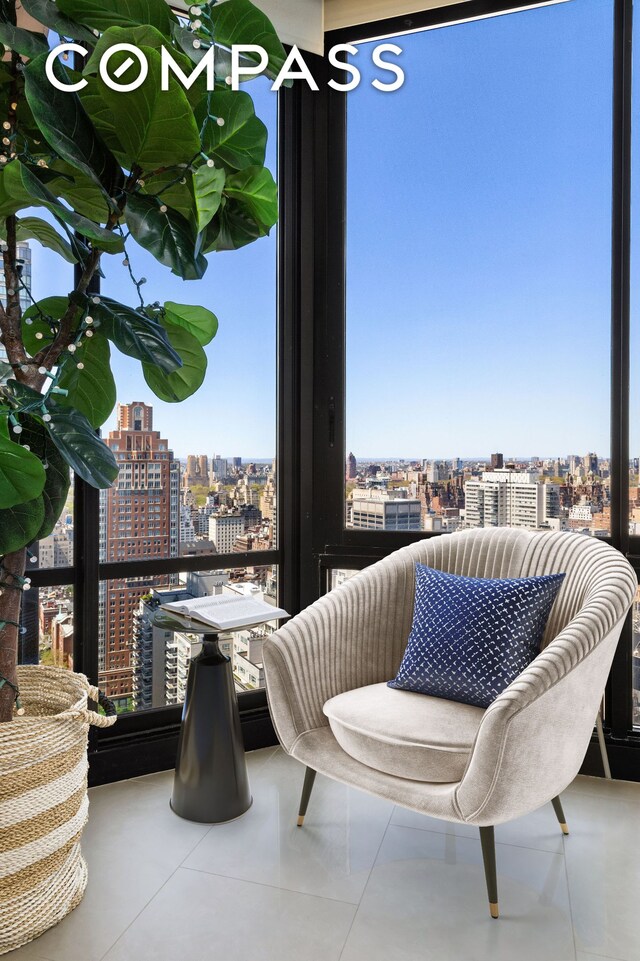 304 E 65th St Unit 38Ad, New York City, NY 10065 - living area featuring a view of city and healthy amount of natural light