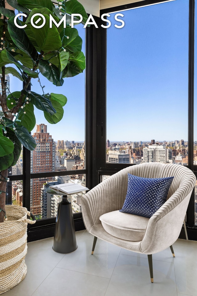 304 E 65th St Unit 38Ad, New York City, NY 10065 - living area featuring a city view and plenty of natural light