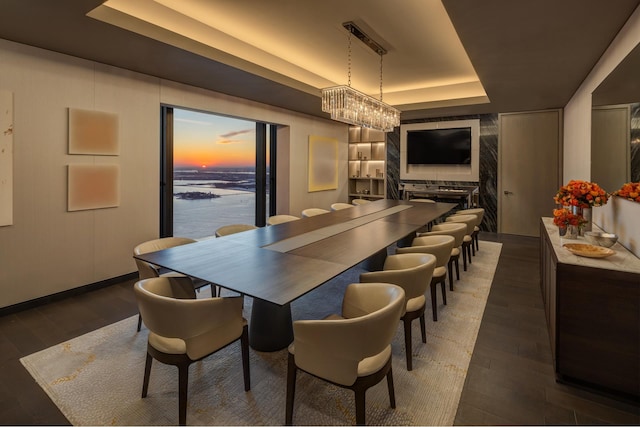 125 Greenwich St Unit 38B, New York City, NY 10006 - dining space with a raised ceiling, wood finished floors, and baseboards