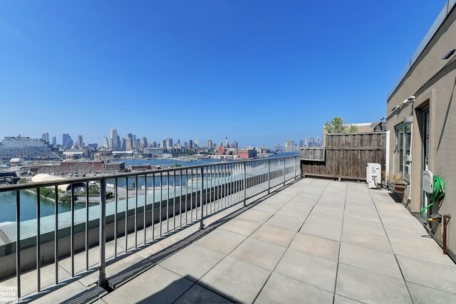 446 Kent Ave Phd, Phd, New York City, NY 11211 - view of patio with a view of skyline and a balcony