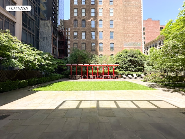 surrounding community featuring a patio and a yard