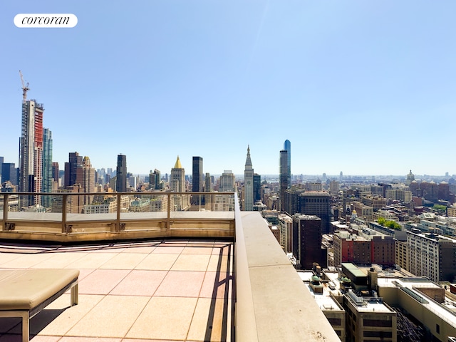 view of patio featuring a view of city and visible vents