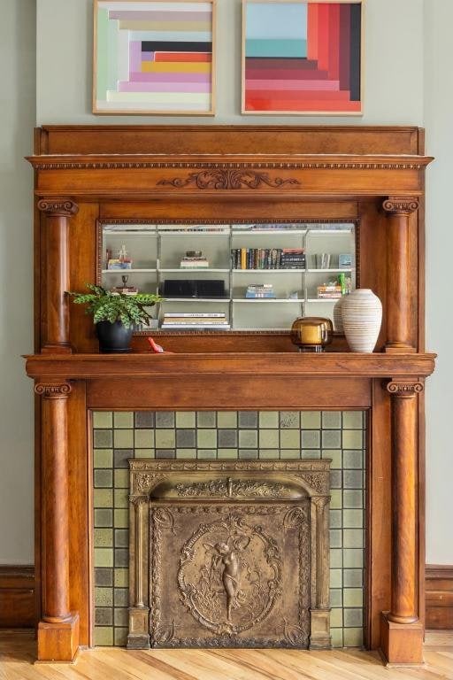 room details featuring a tiled fireplace