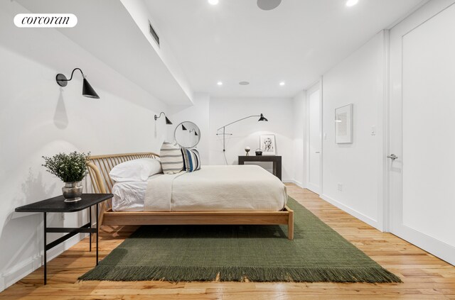 176 Broadway Unit 3C, New York City, NY 10038 - bedroom featuring light wood finished floors, recessed lighting, and baseboards