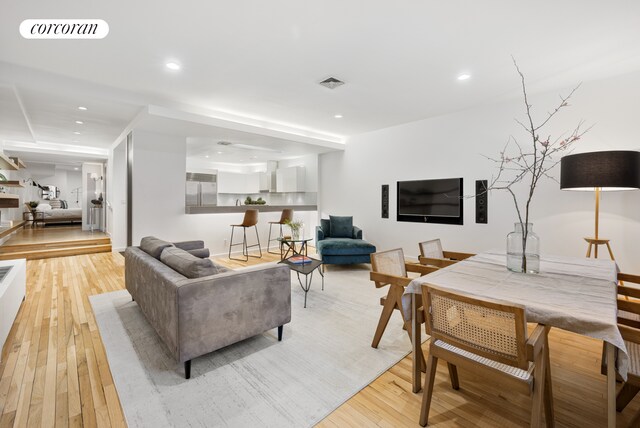 176 Broadway Unit 3C, New York City, NY 10038 - living room featuring light wood finished floors and recessed lighting