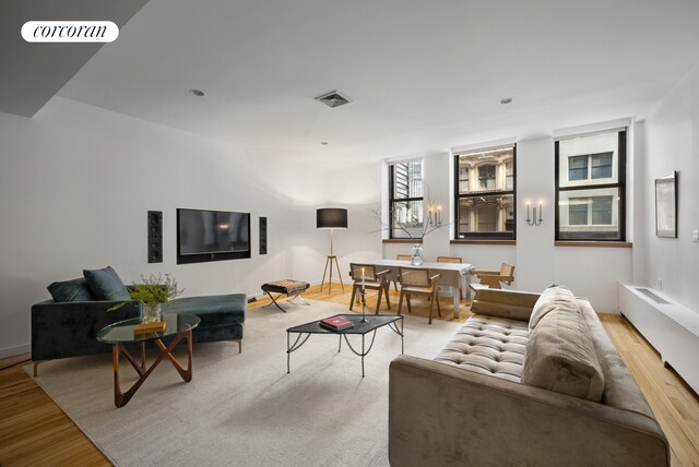 176 Broadway Unit 3C, New York City, NY 10038 - living room featuring wood finished floors