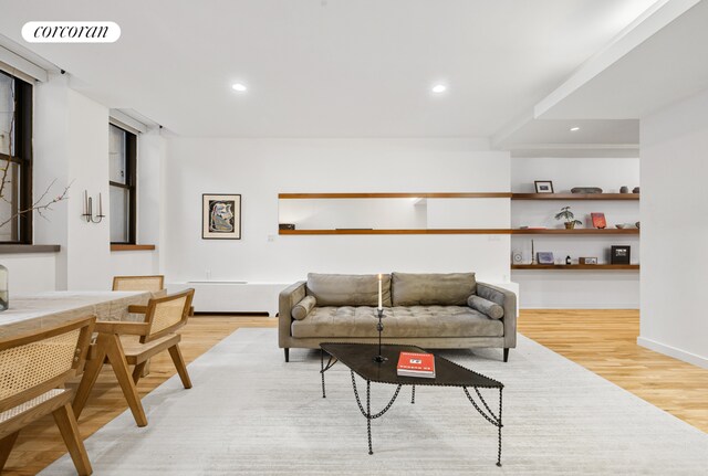 176 Broadway Unit 3C, New York City, NY 10038 - living room with light wood finished floors and recessed lighting