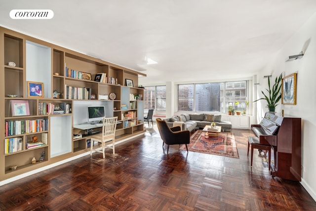 living area featuring dark parquet flooring