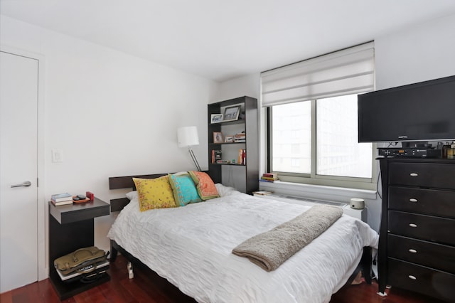 bedroom featuring dark wood-type flooring