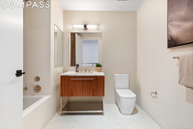 bathroom featuring a bath, tile patterned floors, vanity, and toilet