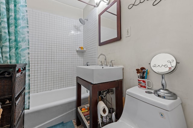 full bathroom featuring toilet, sink, and shower / bath combo with shower curtain