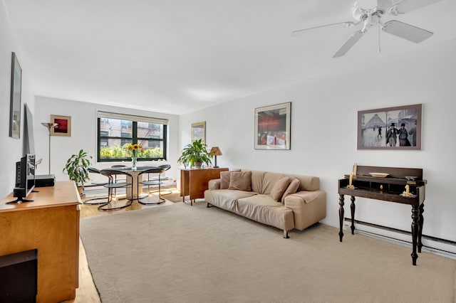 living room featuring a ceiling fan and a baseboard radiator