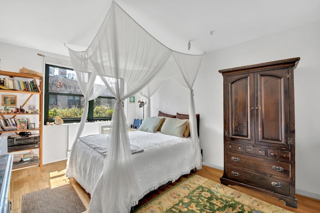 bedroom featuring light wood-type flooring