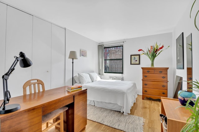 bedroom with light wood finished floors