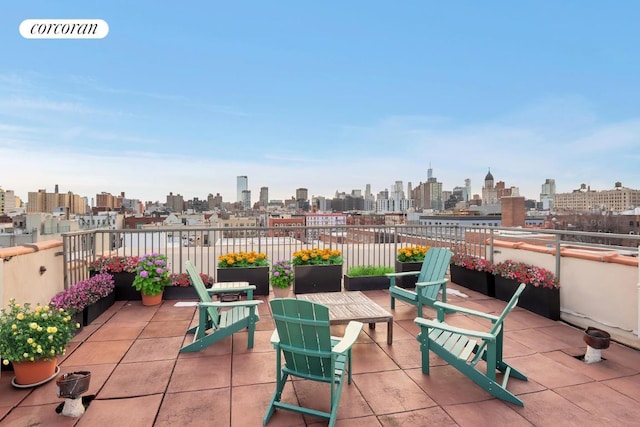 view of patio / terrace featuring a view of city and visible vents