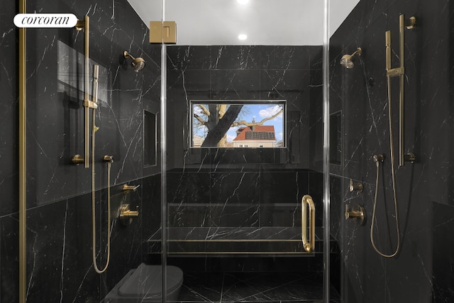 bathroom featuring walk in shower and toilet