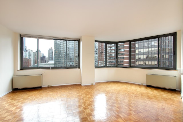 2000 Broadway Unit 11F, New York City, NY 10023 - empty room featuring radiator heating unit and a view of city