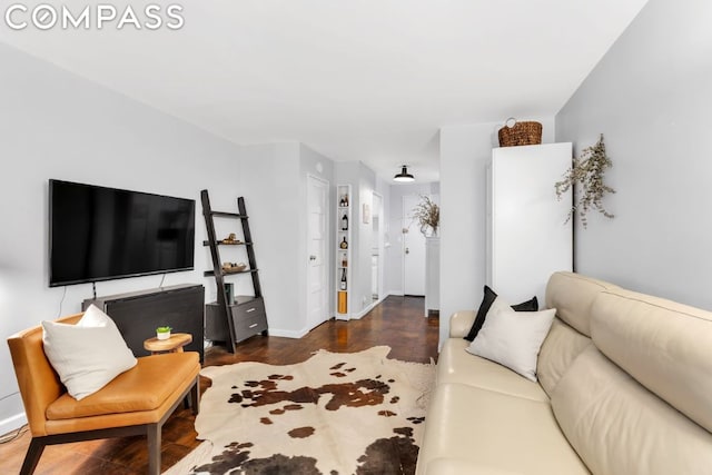 living room with dark hardwood / wood-style floors