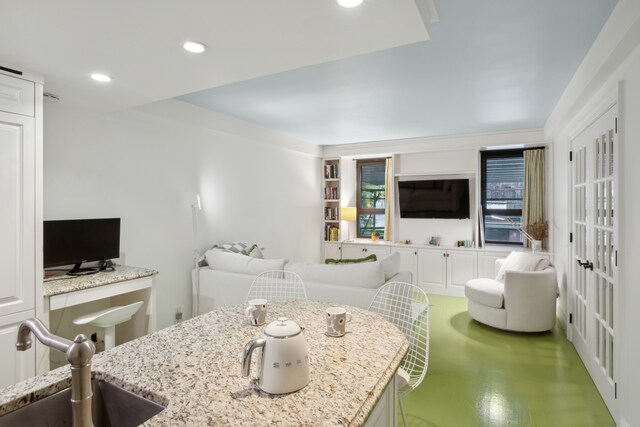 living room with sink and built in features