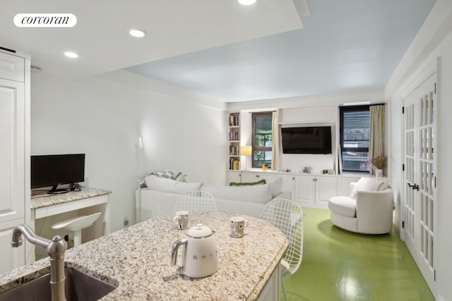 living room featuring sink and built in features