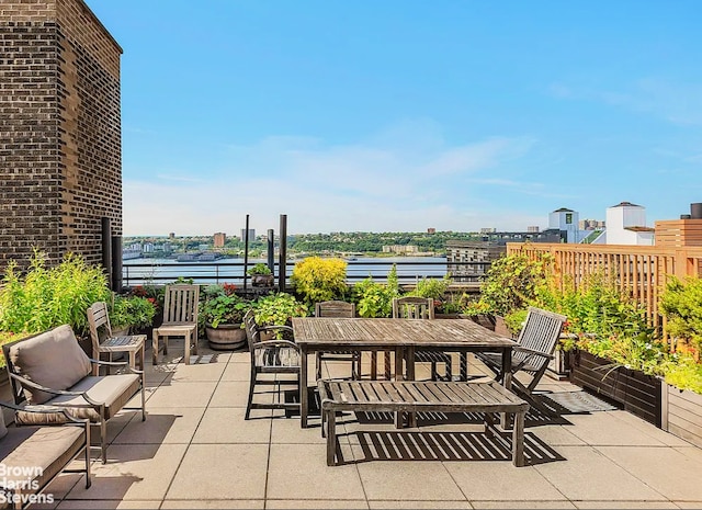 view of patio with a water view