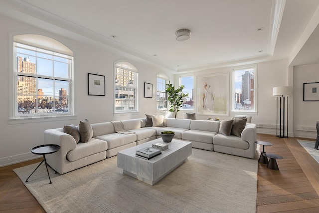 living room featuring baseboards, a wealth of natural light, and wood finished floors