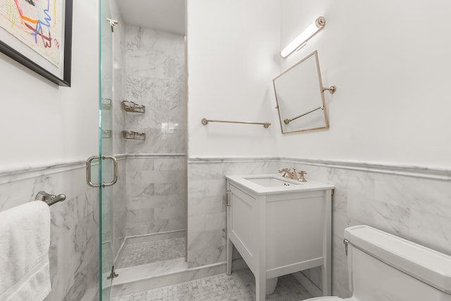 320 E 82nd Street Penthouse, New York City, NY 10028 - full bathroom with a stall shower, a wainscoted wall, toilet, vanity, and tile walls