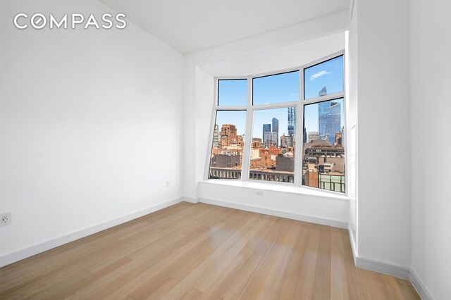 empty room with light hardwood / wood-style floors