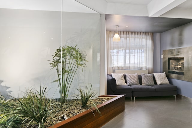 living room featuring tile patterned floors and a fireplace