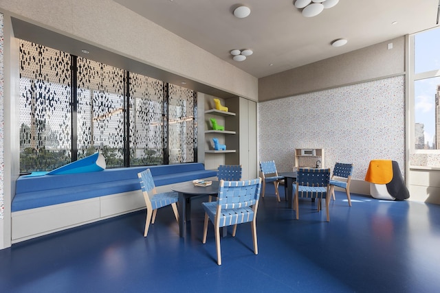 dining room featuring built in features and a healthy amount of sunlight