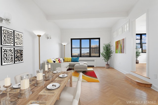 dining room featuring radiator, plenty of natural light, and beam ceiling